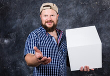 Joyful Bearded Man In Shirt With Blanc Cube Object For Your Logo