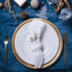 Christmas or New Year table setting. Place setting for Christmas Dinner. Holiday Decorations.