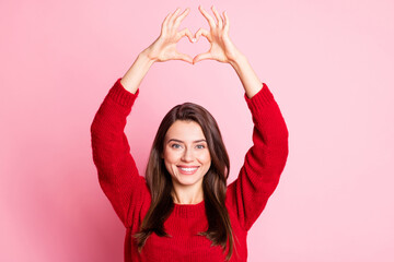 Sticker - Photo of young lovely girl raise arms show heart shape toothy smile wear red pullover isolated pink color background