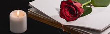 Red Rose On Holy Bible Near Candle On Black , Funeral Concept, Banner