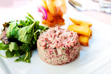 Wall Mural - Tasty Steak tartare (Raw beef) - classic steak tartare on white plate