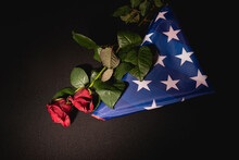 Top View Of Red Roses And American Flag On Black , Funeral Concept