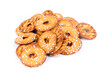 Pile of salty round pretzel pieces isolated over white