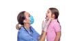 © Julia - Vaccination concept. Female doctor pediatrician examines before vaccinating cute little girl on white background, closeup. isolated. doctor looks at the child's throat.