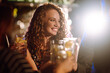 © maxbelchenko - Young woman is holding in his hand a glass of alcoholic Сocktail. Party, celebration, friends, bachelorette party, birthday, winter holidays concept.
