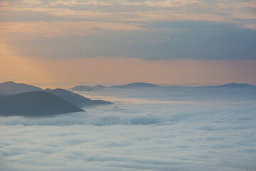 Wall Mural - beautiful sunrise in the carpathian mountains with fog and dramatic sky