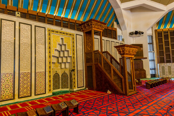 Wall Mural - Interiors with red Arabic traditional carpet in King Abdullah I Mosque in Amman, Jordan, built in 1989 by late King Hussein in honor of his father