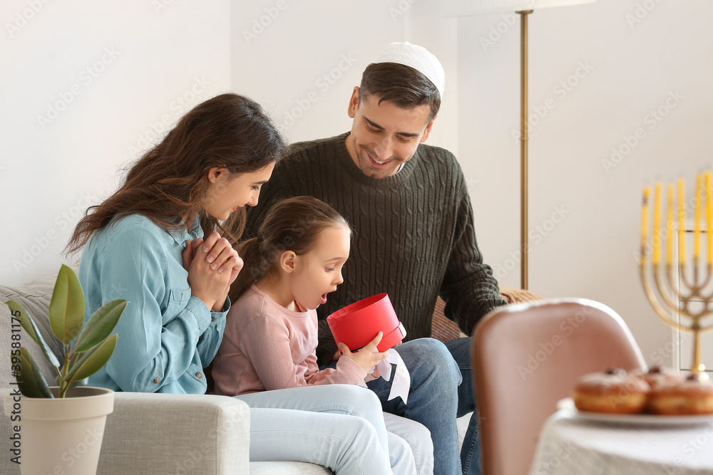 Happy family celebrating Hannukah at home