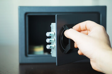 Open safe in a wealthy house. Safety box in hotel room. Concept safe storage of money and documents