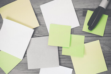 Poster - High angle shot of blank papers and a marker on a wooden surface