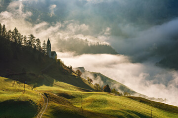 Wall Mural - Landscape of beautiful village with church in Dolomites mountains