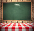 Blank menu chalkboard on wooden wall with dining table template background
