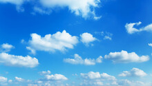 Sunny Background, Blue Sky With White Cumulus Clouds 