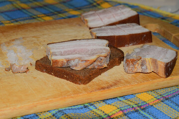 lard cut into pieces on a wooden Board