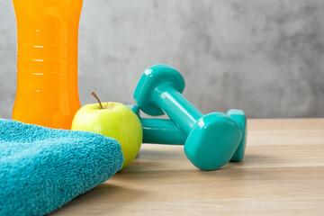 Fitness equipment on a wooden background