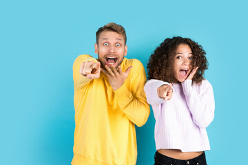 Wall Mural - Man and african american woman standing on blue background