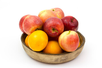 Wall Mural - fresh fruits in a clay bowl - oranges and apples