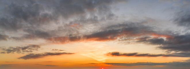 Bright and intense Panorama twilight cloudy sky. Evening background image