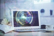 © peshkova - Double exposure of desktop computer and technology theme hologram. Concept of software development.