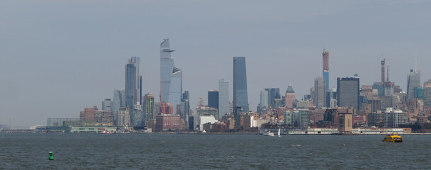 Wall Mural - Skyline view of skyscrapers from opposite side of Hudson gulf (New Jersey) to Manhattan, NY. New York City is Financial capital of America.