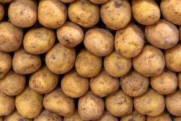 Close-up, potatoes standing in a row on the counter in the marketplace