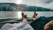 © Chris - Couple relaxing on the sun beds in Spa, Badehaus Millstaetter See, Austria, by Millstaetter See. Only the legs are visible and some parts of bathrobes. Snowy mountains in the back, snow on the terrace