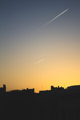 Wall Mural - planes in the sky with skyline in madrid