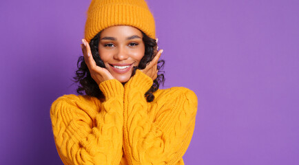 Wall Mural - Ethnic female smiling and touches her cheeks with her hands.