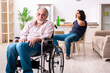 © Elnur - Old man in wheel-chair and young bad caregiver indoors