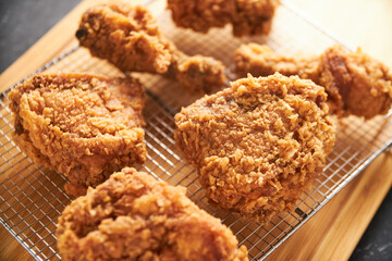 Wall Mural - crispy southern style fried chicken in a black stone table