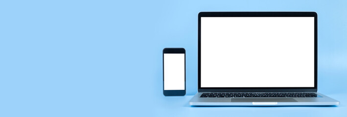 Mockup image computer, smart watch, cell phone with blank screen for typing text in workplace on desk at office. Conception design creative work space on blue background. Modern digital devices