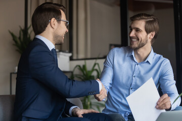 Poster - Good deal. Two business partners shaking hands after signing contract, client satisfied of getting loan insuring life handshaking with banker, happy job applicant appreciating hr for receiving place