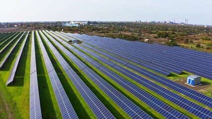 Wall Mural - Power plant using renewable solar energy. Aerial UHD 4K drone realtime video, shot in 10bit HLG and colorized