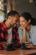 © Jacob Lund - Romantic couple on a date in a cafe