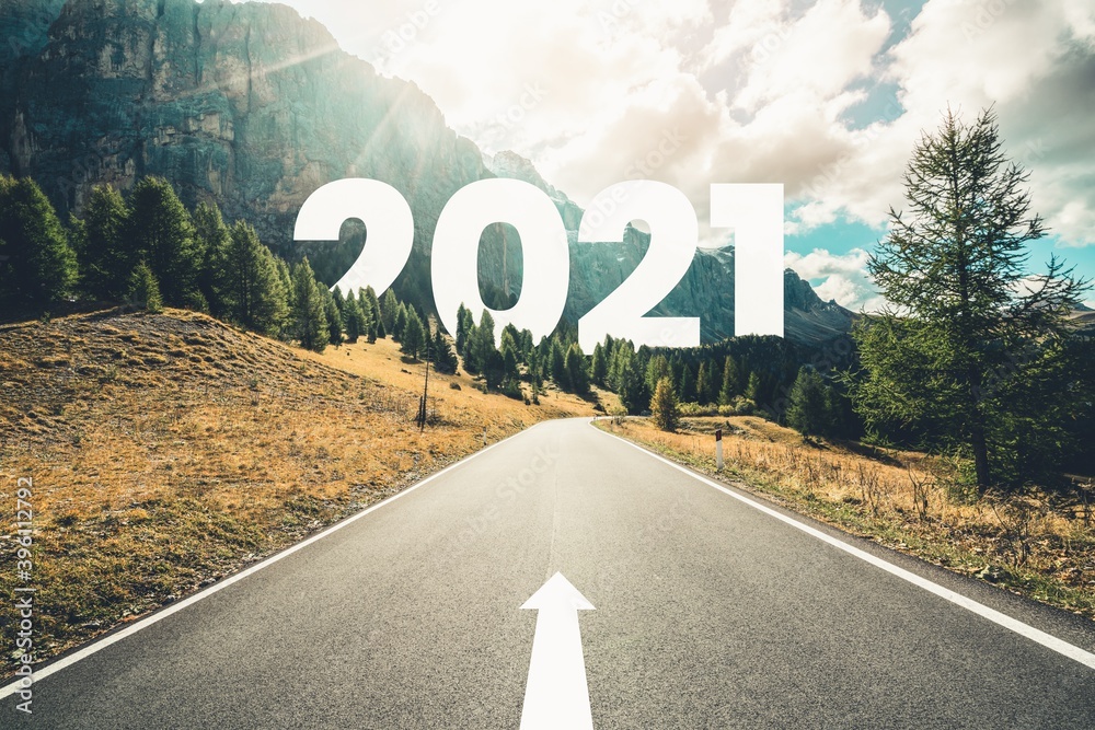 2021 New Year road trip travel and future vision concept . Nature landscape with highway road leading forward to happy new year celebration in the beginning of 2021 for fresh and successful start . - obrazy, fototapety, plakaty 