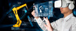 © InfiniteFlow - Engineer controls robotic arms by augmented reality industry technology application software. Smart robot machine in future factory working in concept of Industry 4.0 or 4th industrial revolution.