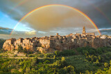 Fototapeta Tęcza - Rainbow over a medieval town of Pitigliano at sunset, Pitigliano, Tuscany, Italy