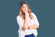 © Krakenimages.com - Young caucasian woman wearing casual clothes thinking worried about a question, concerned and nervous with hand on chin