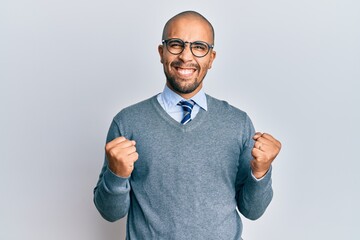 Poster - Hispanic adult man wearing glasses and business style excited for success with arms raised and eyes closed celebrating victory smiling. winner concept.