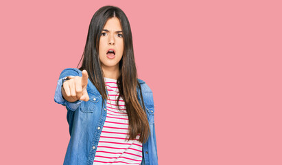 Sticker - Young brunette woman wearing casual clothes pointing displeased and frustrated to the camera, angry and furious with you