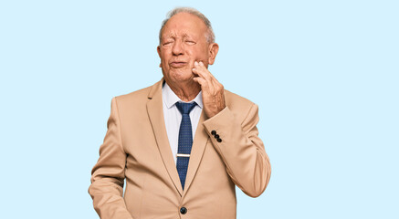 Canvas Print - Senior caucasian man wearing business suit and tie touching mouth with hand with painful expression because of toothache or dental illness on teeth. dentist