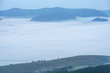 Wall Mural - Beautiful sunrise in the Carpathian mountains with fog and dramatic sky