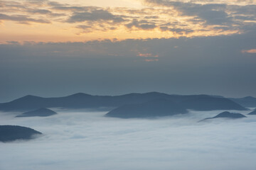 Wall Mural - Beautiful sunrise in the Carpathian mountains with fog and dramatic sky