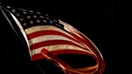 Wall Mural - Waving American Flag on Black Background. Lots of Copy Space.