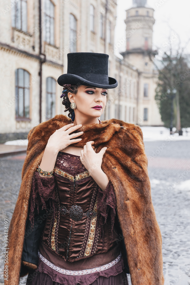 retro style portrait of beautiful woman in vintage suit and top hat ...