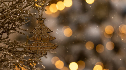 Wall Mural - Wooden Christmas tree toy on a blurred bokeh background. Close-up, blurred background. Festive New Year background.