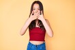 © Krakenimages.com - Young beautiful chinese girl wearing summer clothes shocked covering mouth with hands for mistake. secret concept.