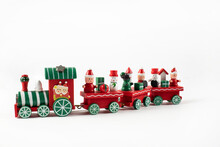 Wooden Toy Train. Christmas Trip On A White Isolated Background. Christmas Card. Copy Space.