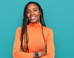 African american woman wearing casual clothes happy face smiling with crossed arms looking at the camera. positive person.