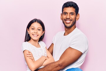 Canvas Print - Young father and daughter wearing casual clothes with a happy and cool smile on face. lucky person.